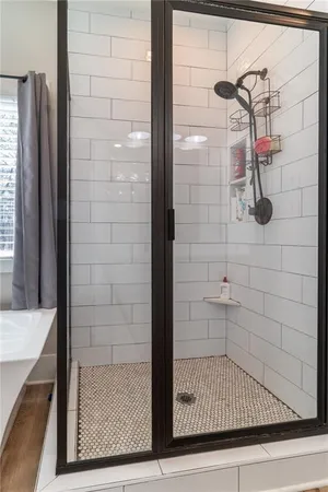 a bedroom with a bed and a ceiling fan