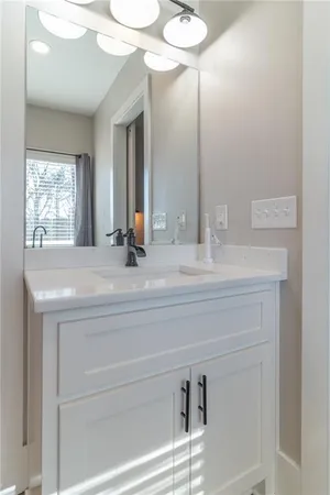 a white toilet sitting next to a shower curtain