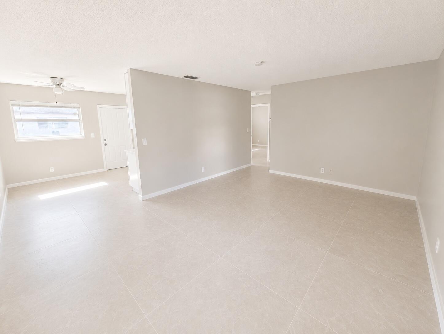 1794 Juno Road, Unit 2 North Palm Beach, FL 33408 - Photo 2 of 9 a view of an empty room with a window