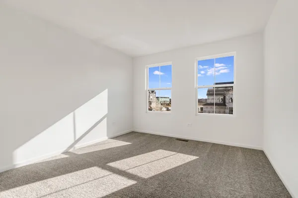 a view of an empty room with windows