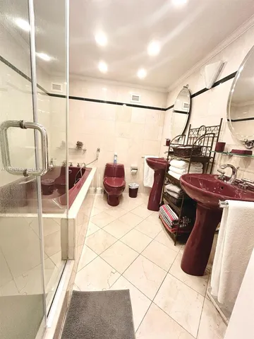 a bedroom with a bed and a television