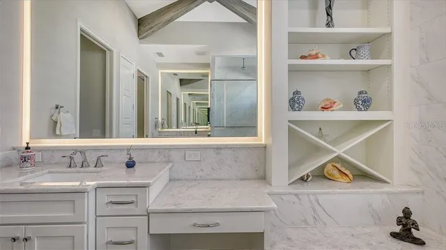 a bathroom with a sink and a mirror