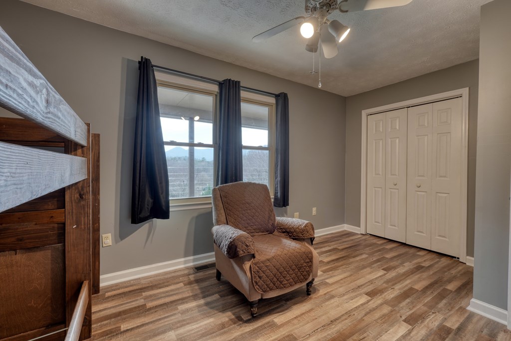 2276 Lovingood Road Hiawassee, GA 30546 - Photo 21 of 54 a living room with furniture and a fireplace