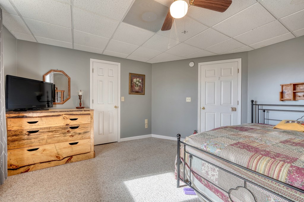 2276 Lovingood Road Hiawassee, GA 30546 - Photo 27 of 54 a bedroom with a bed and a television