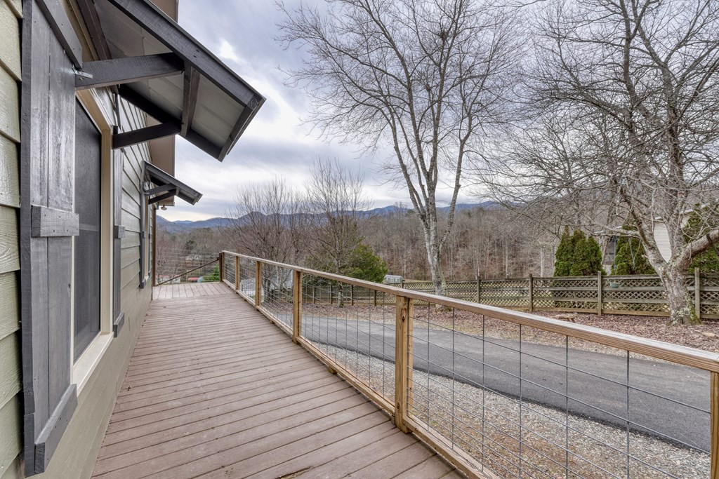 2276 Lovingood Road Hiawassee, GA 30546 - Photo 34 of 54 a view of a balcony with wooden floor and fence