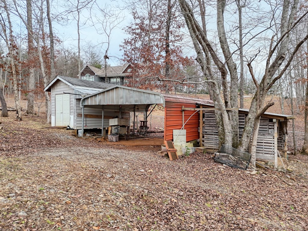 2276 Lovingood Road Hiawassee, GA 30546 - Photo 45 of 54 a front view of a house with garden
