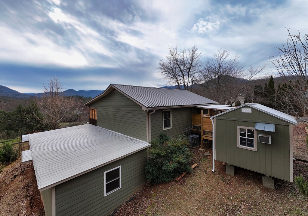 2276 Lovingood Road Hiawassee, GA 30546 - Photo 5 of 54 a aerial view of a house with a yard and garage