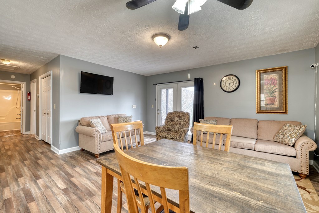 2276 Lovingood Road Hiawassee, GA 30546 - Photo 10 of 54 a living room with furniture and a flat screen tv