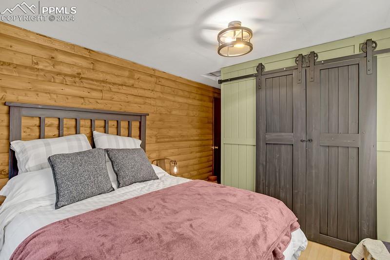 361 Willow Road Divide, CO 80814 - Photo 20 of 28 a bedroom with a bed and cabinets