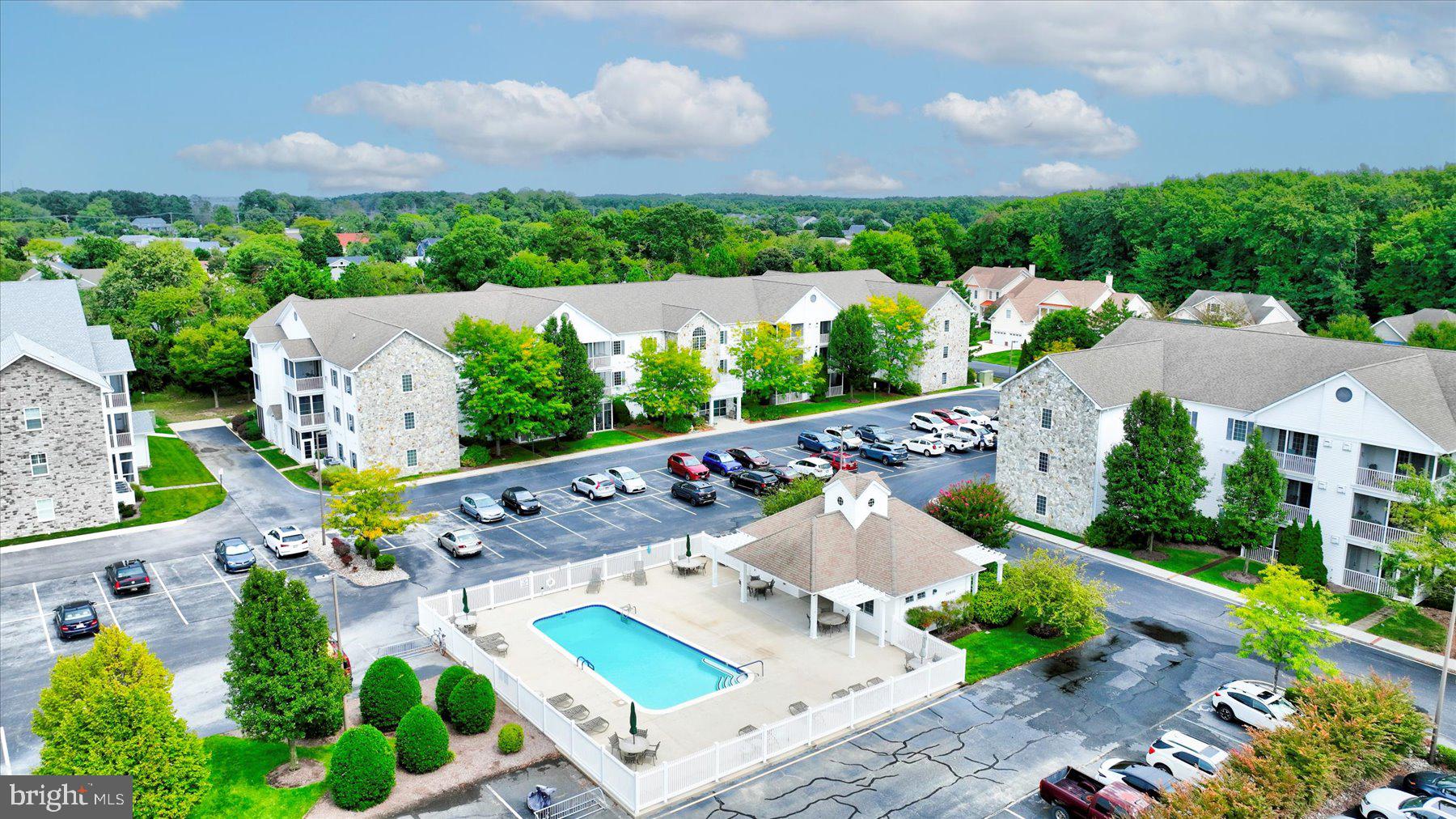 30611 Cedar Neck Road, Unit 2204 Ocean View, DE 19970 - Photo 2 of 33 an aerial view of a house with a garden