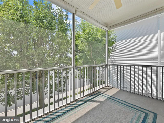 a view of a balcony with wooden floor