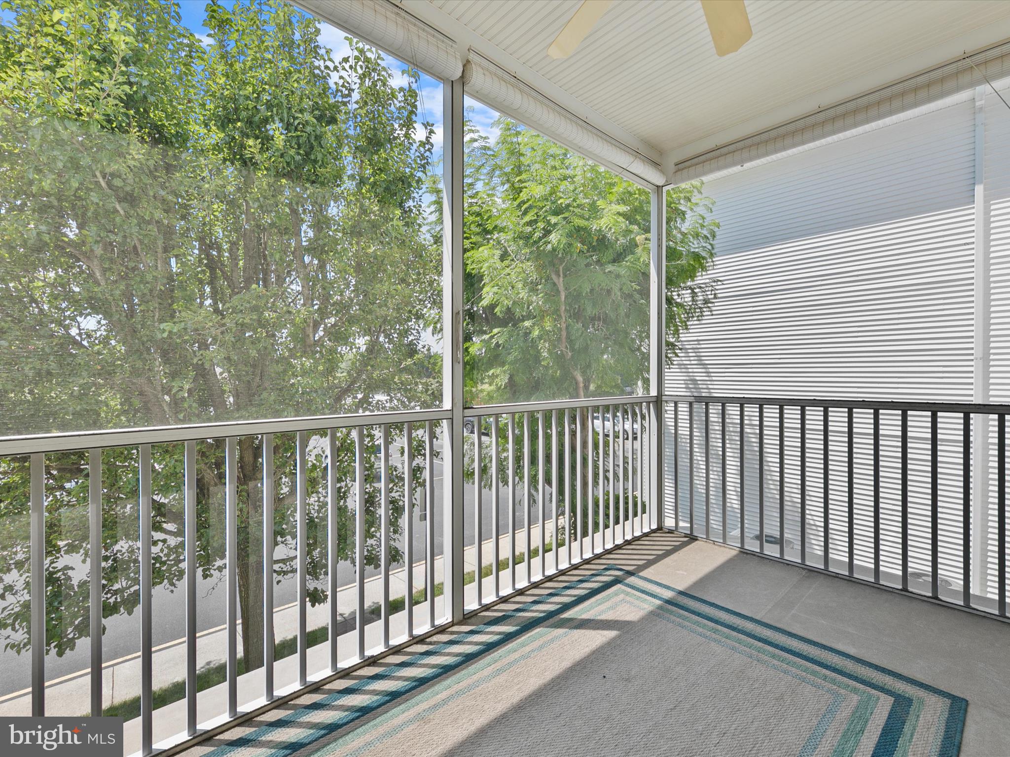 30611 Cedar Neck Road, Unit 2204 Ocean View, DE 19970 - Photo 24 of 33 a view of a balcony with wooden floor