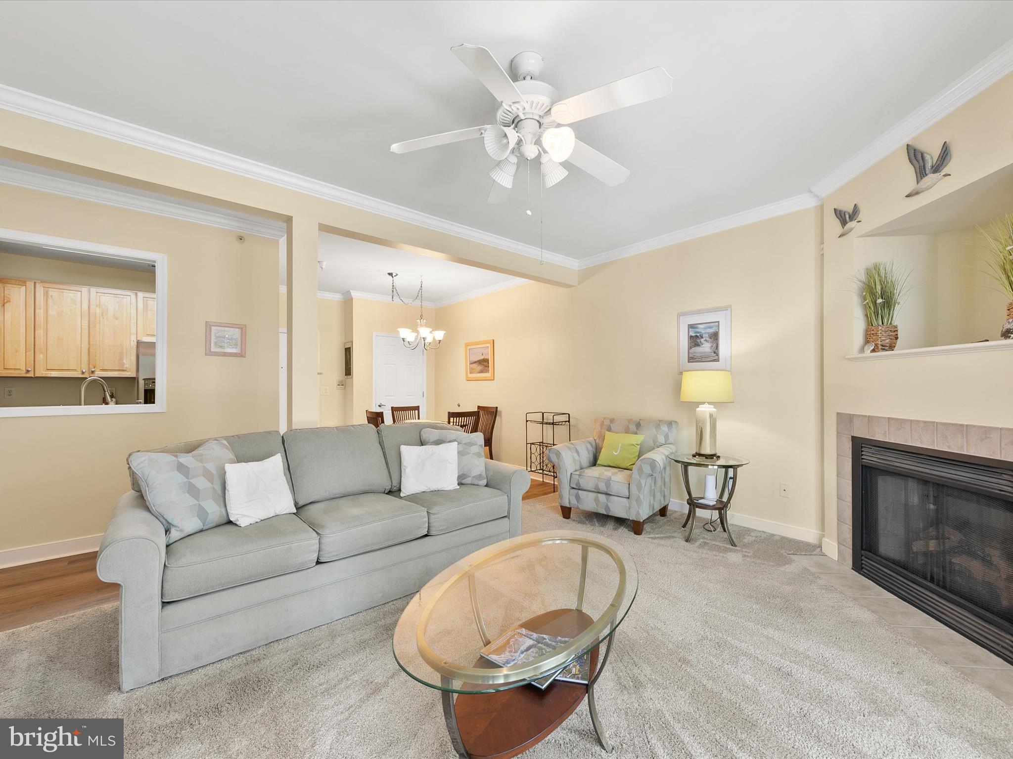 30611 Cedar Neck Road, Unit 2204 Ocean View, DE 19970 - Photo 6 of 33 a living room with furniture and a fireplace
