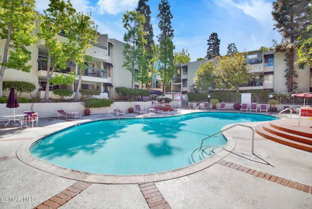 a view of a swimming pool with a sitting space