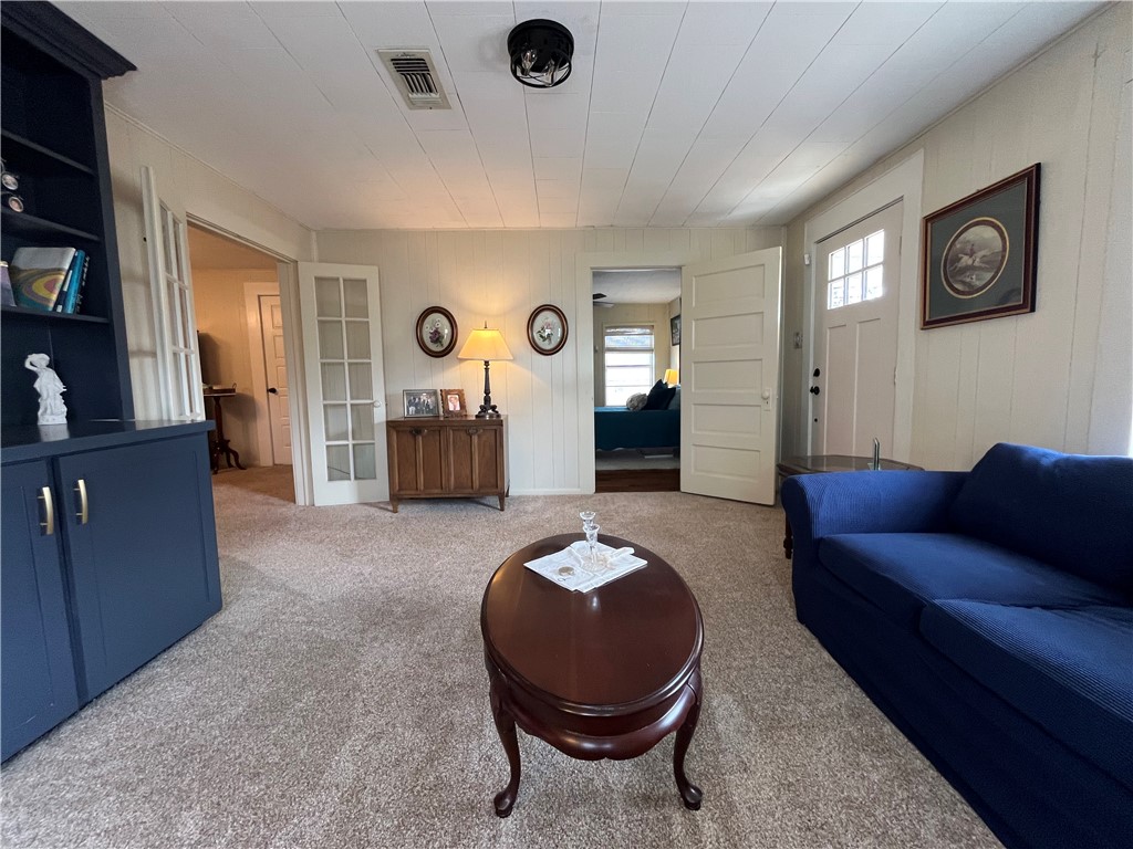 1102 North Travis Avenue Cameron, TX 76520 - Photo 4 of 48 Living room featuring carpet flooring
