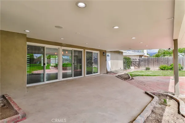 a view of a house with a backyard and porch