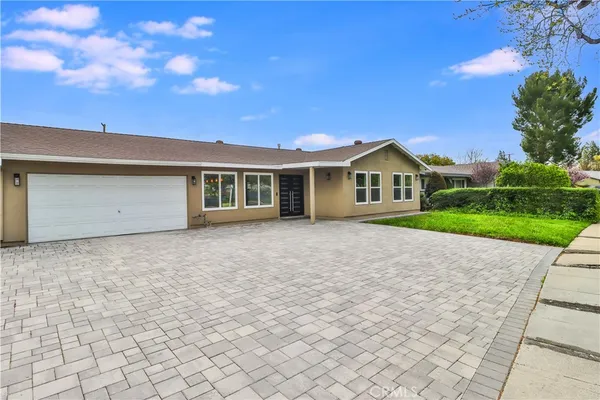 a house view with a garden space