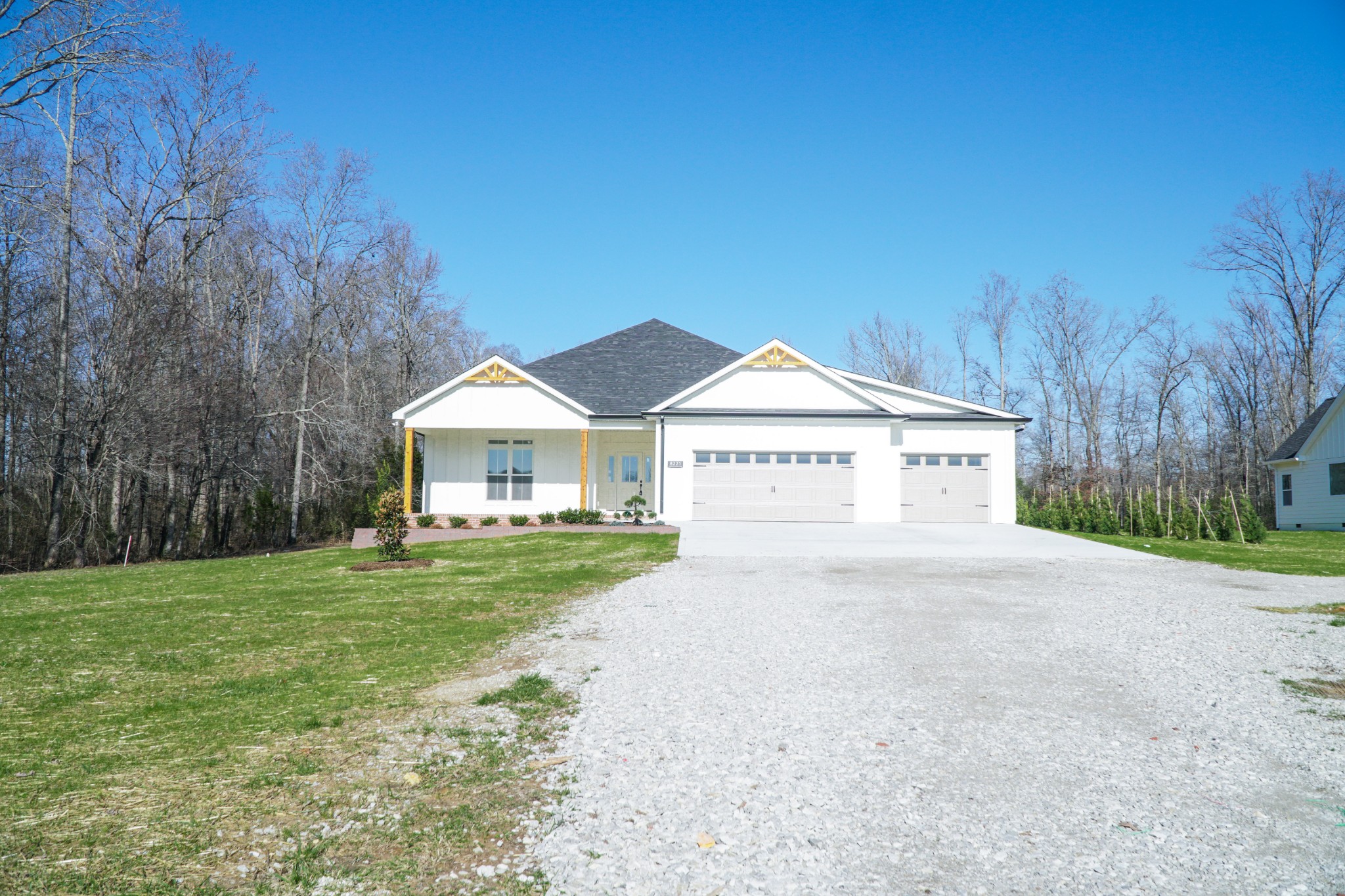 8221 Cookeville Boatdock Road Baxter, TN 38544 - Photo 1 of 13 a view of a house with a yard and a garage