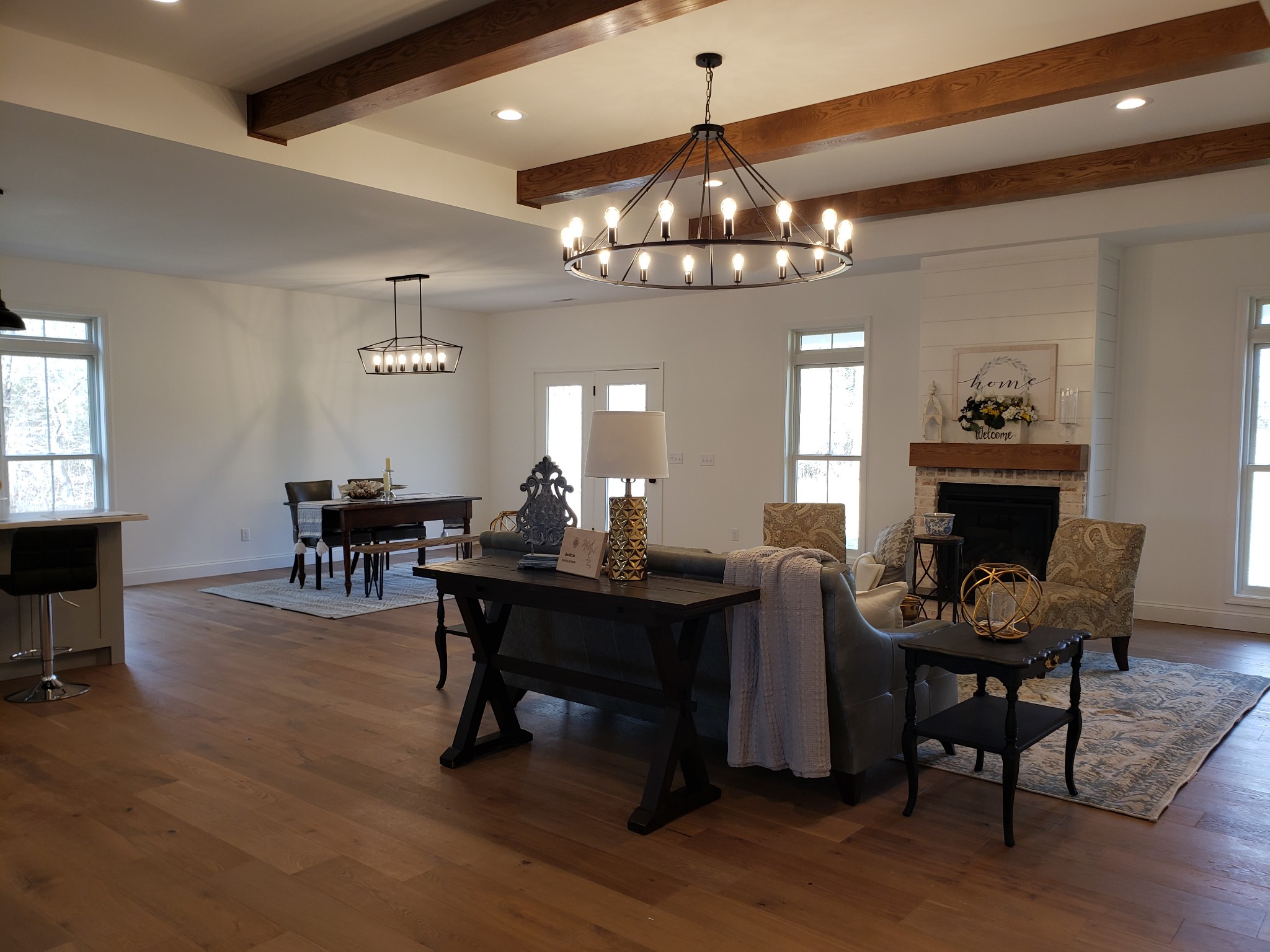 8221 Cookeville Boatdock Road Baxter, TN 38544 - Photo 4 of 13 a view of a dining room with furniture a chandelier and wooden floor