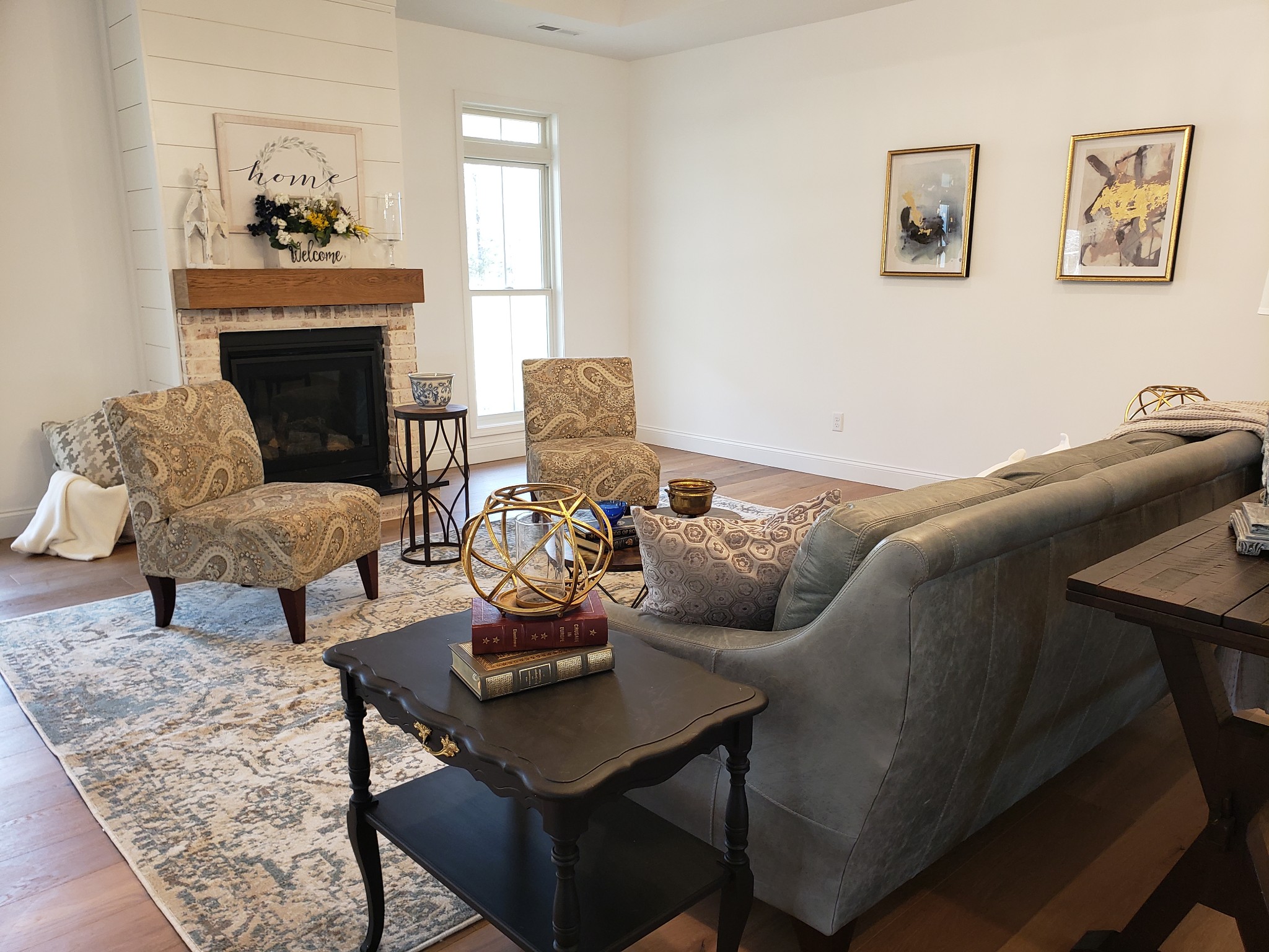 8221 Cookeville Boatdock Road Baxter, TN 38544 - Photo 5 of 13 a living room with furniture a fireplace and a chandelier