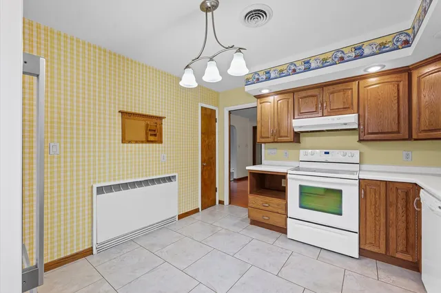 a bathroom with a sink a mirror and a shower