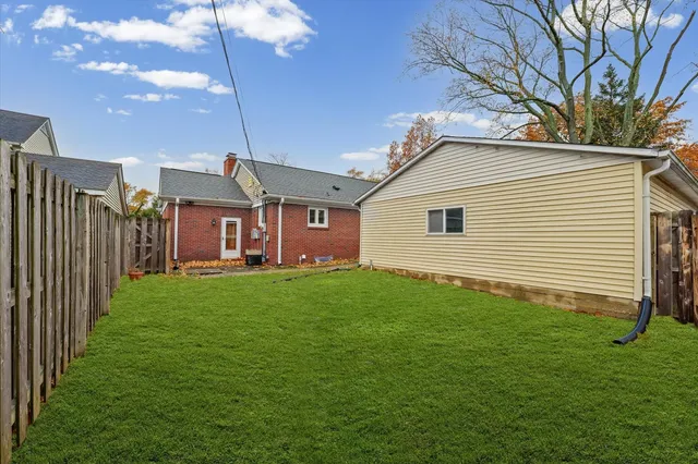 a view of backyard with a patio