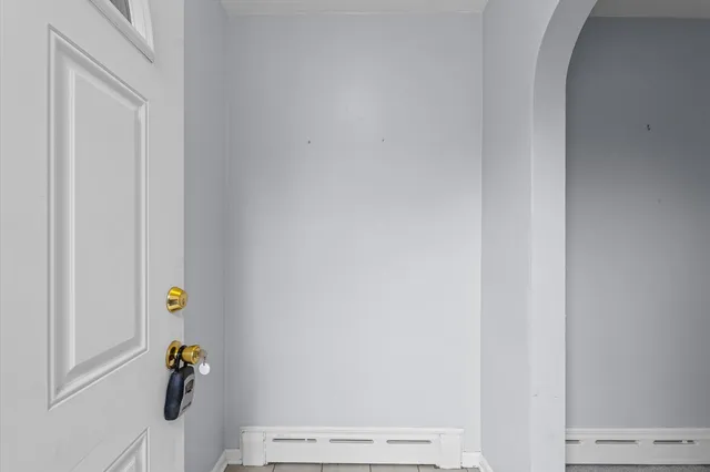 a view of an empty room with a fireplace