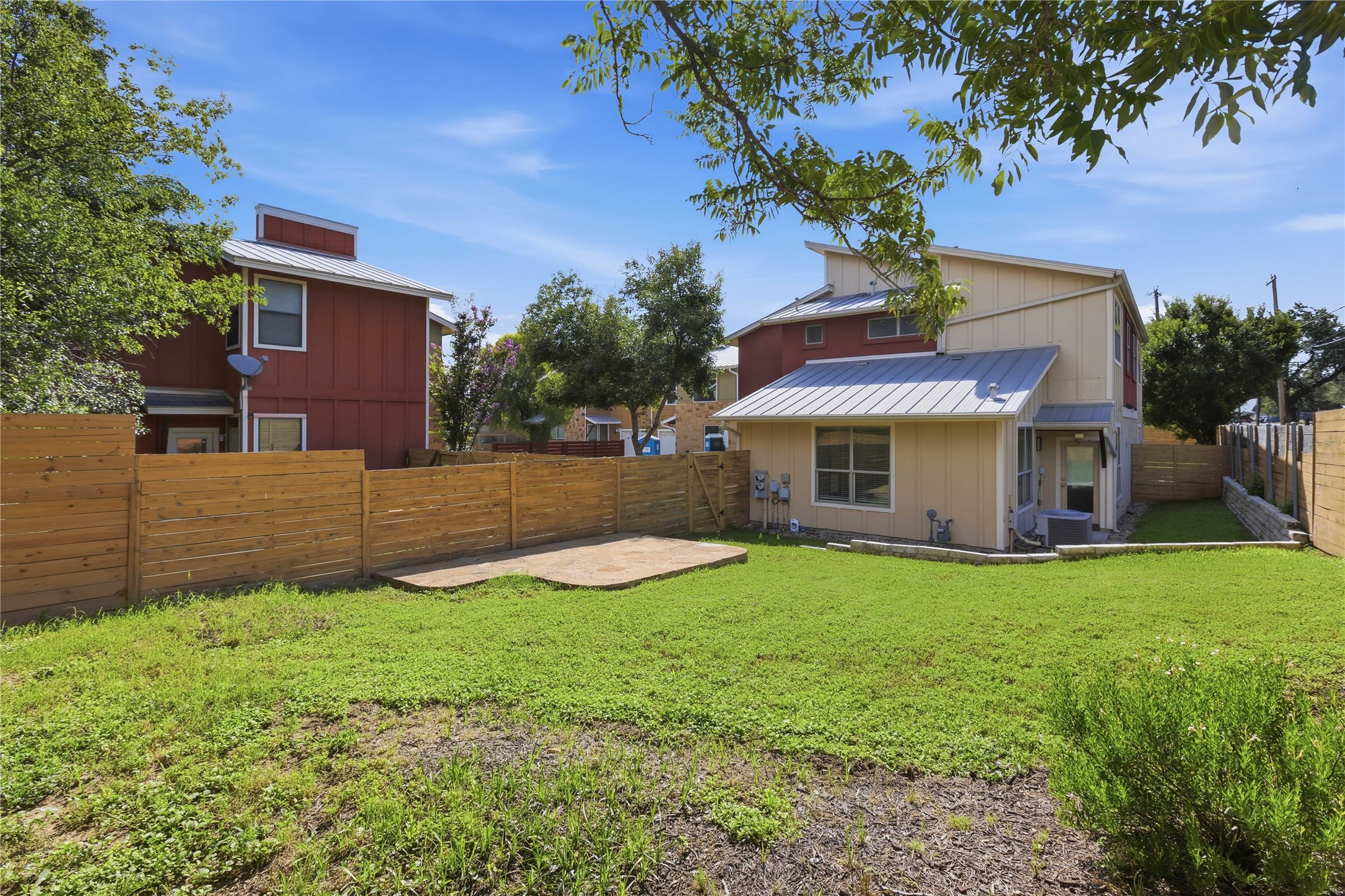 4124 Valley View Road, Unit 4A & 4B Austin, TX 78704 - Photo 15 of 40 A generous grassy yard with a private fence offers ample outdoor space and a small patio area.