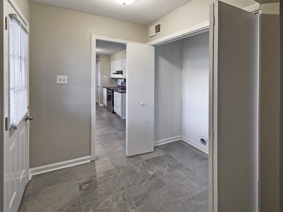 6731 Starkenburg Lane Memphis, TN 38115 - Photo 9 of 17 an empty room with closet and a window