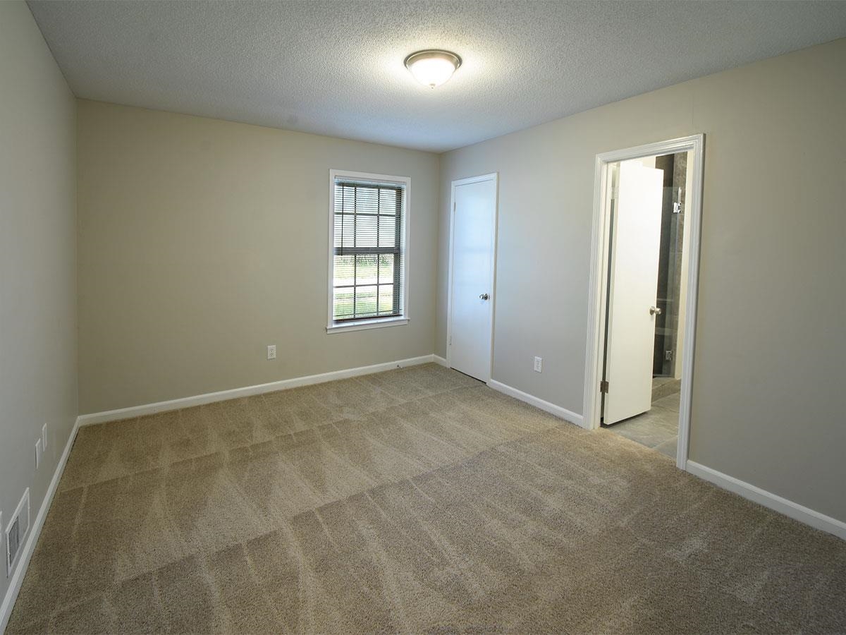 6731 Starkenburg Lane Memphis, TN 38115 - Photo 10 of 17 a view of an empty room with a window