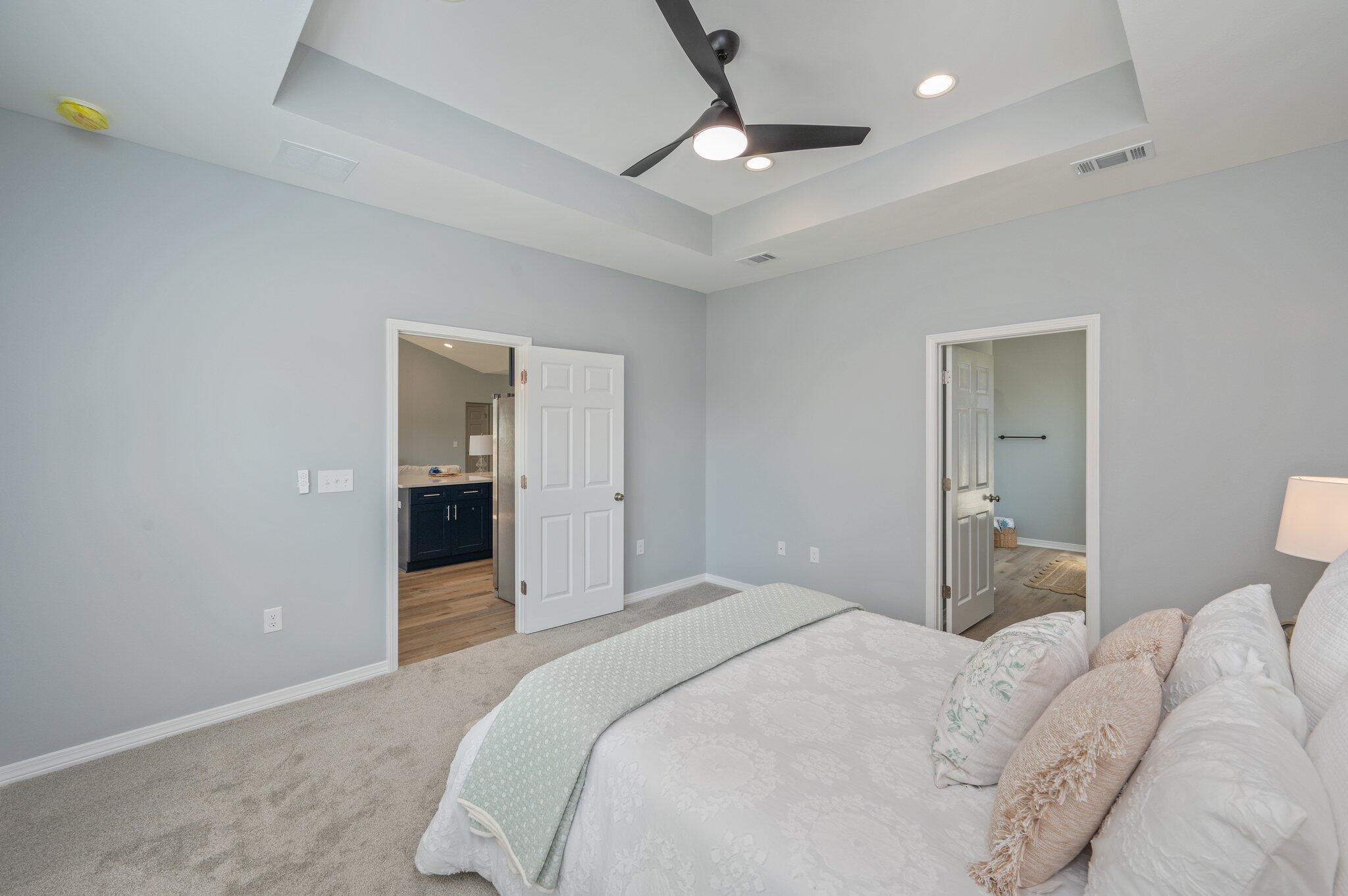 6010 Sand Hill Road Crestview, FL 32539 - Photo 19 of 33 a bedroom with a bed and a chandelier