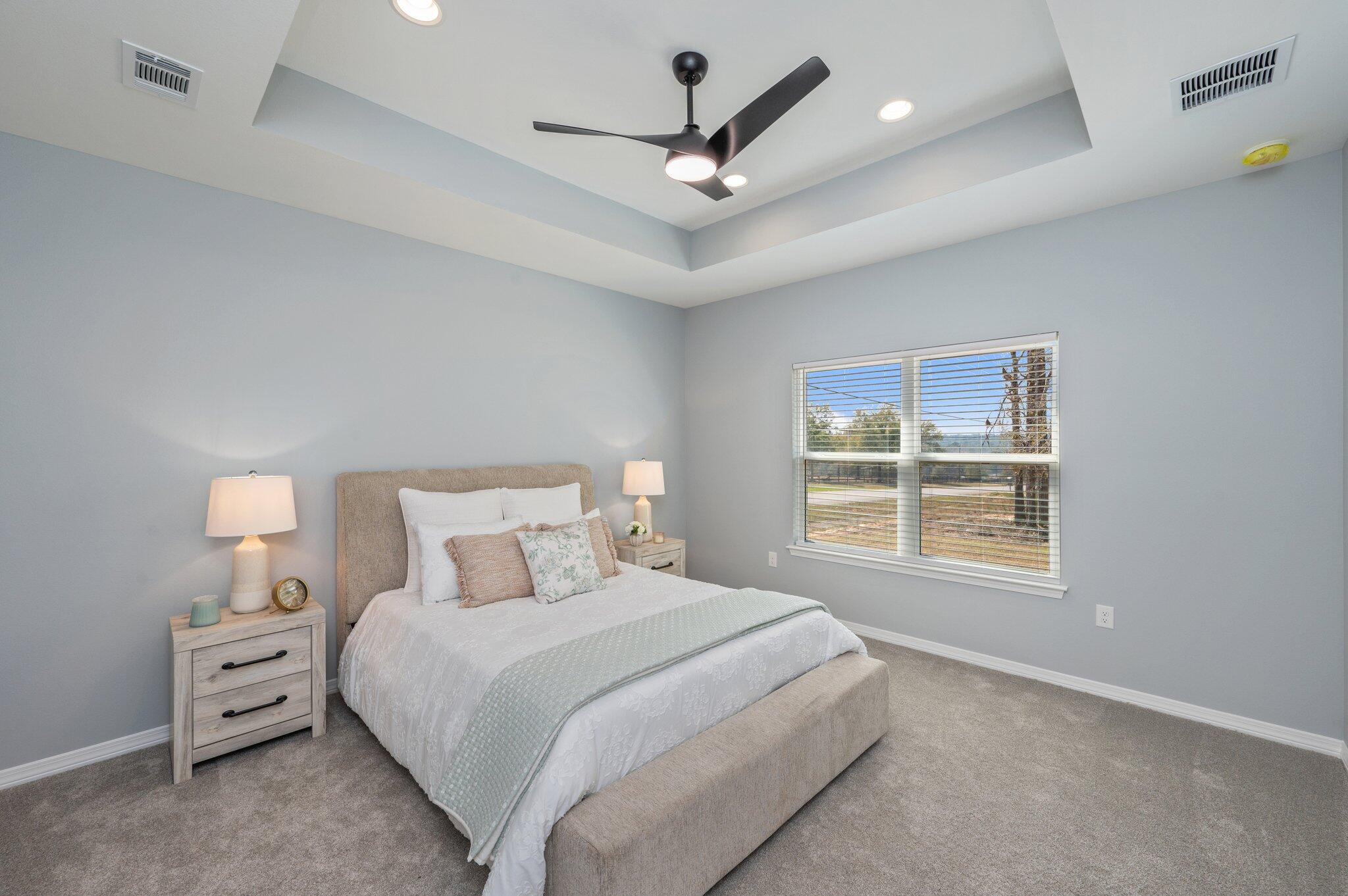6010 Sand Hill Road Crestview, FL 32539 - Photo 20 of 33 a bedroom with a large bed and a ceiling fan