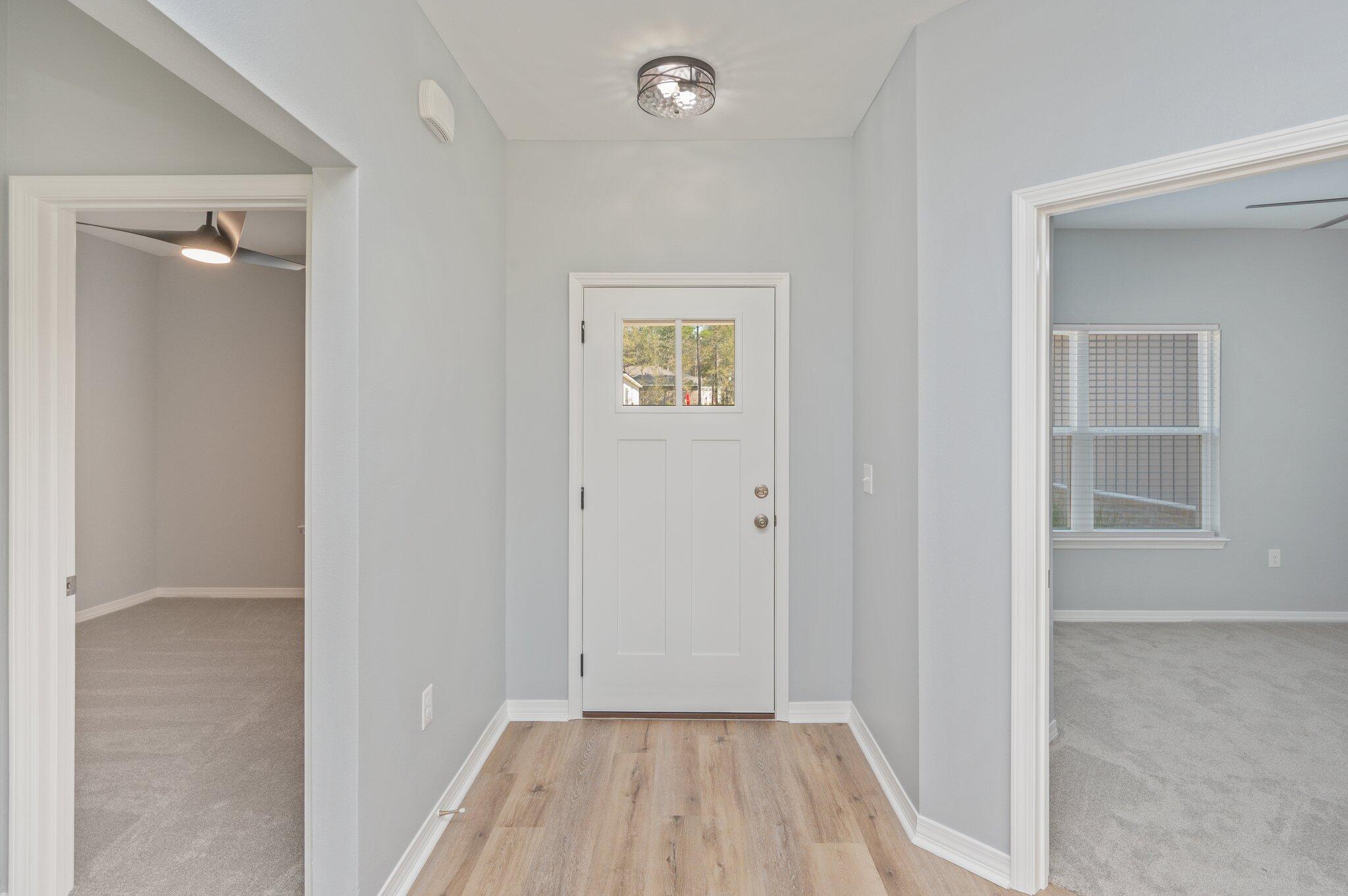 6010 Sand Hill Road Crestview, FL 32539 - Photo 4 of 33 a view of room with window and hardwood floor