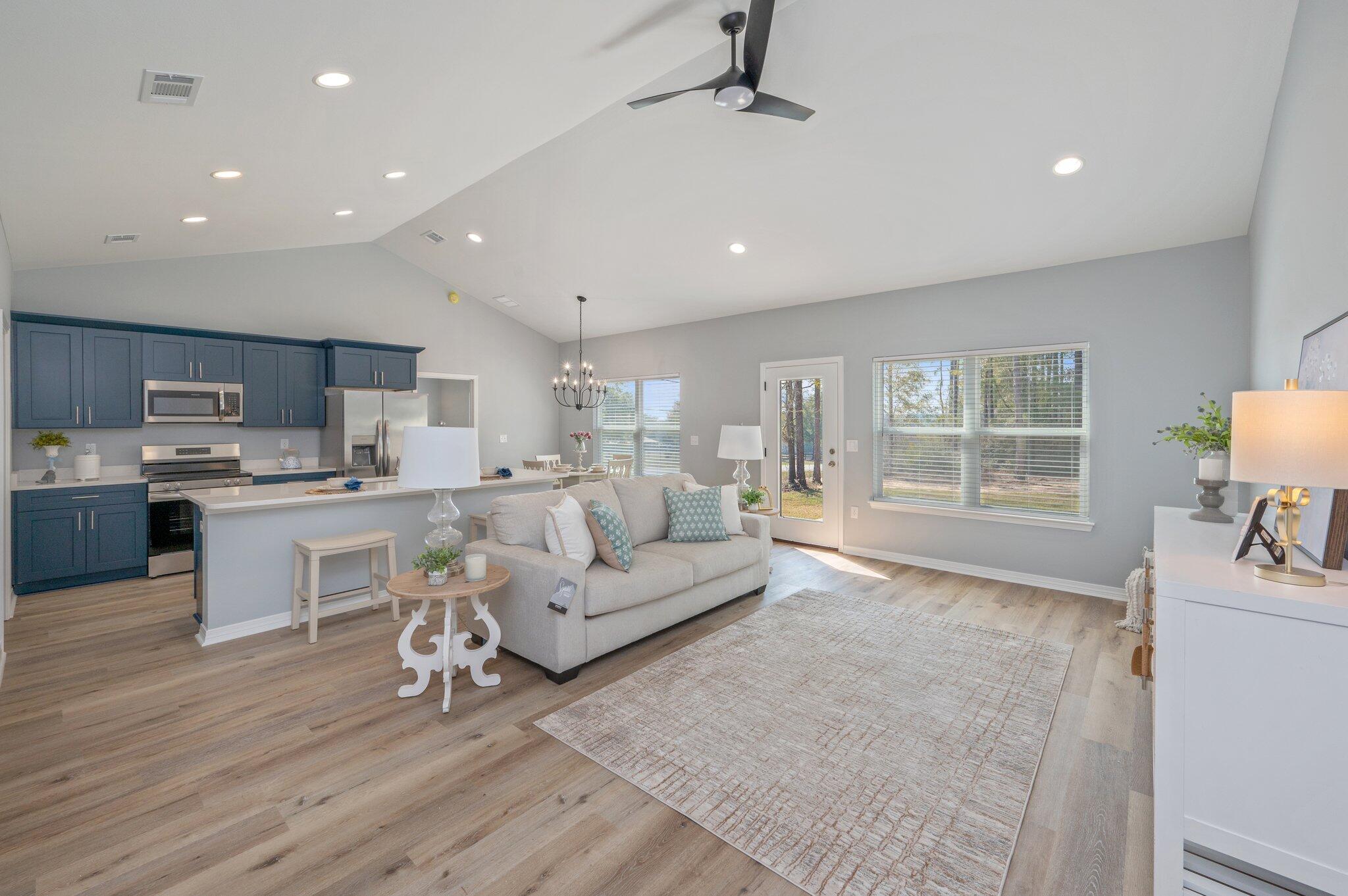 6010 Sand Hill Road Crestview, FL 32539 - Photo 5 of 33 a living room with furniture and a wooden floor