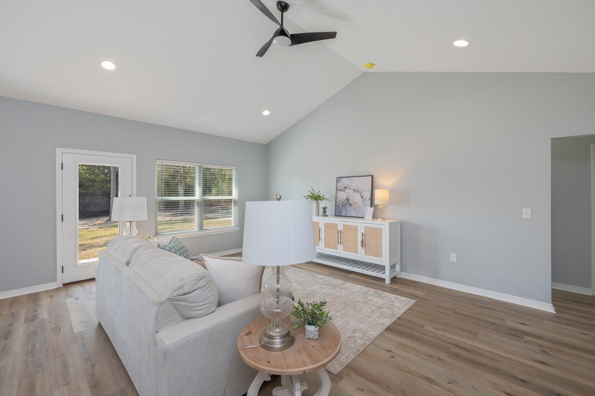 6010 Sand Hill Road Crestview, FL 32539 - Photo 6 of 33 a living room with furniture and a large window