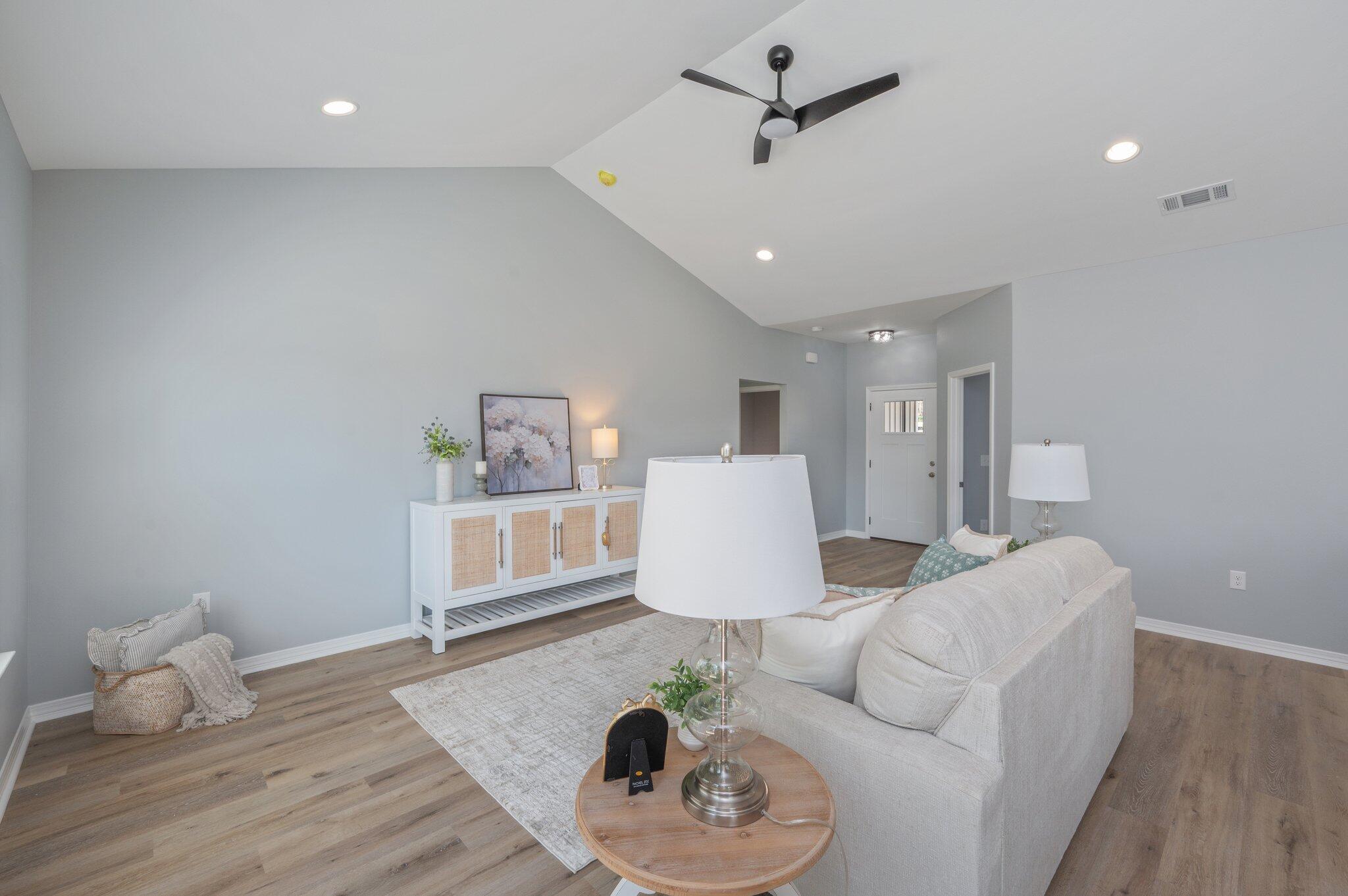 6010 Sand Hill Road Crestview, FL 32539 - Photo 7 of 33 a living room with furniture and a wooden floor