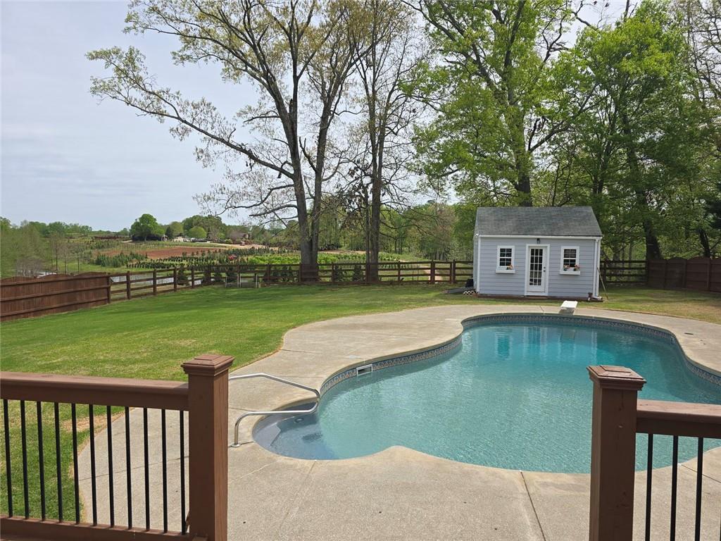7125 Creek Ridge Drive Gainesville, GA 30506 - Photo 3 of 4 a view of house with swimming pool and yard