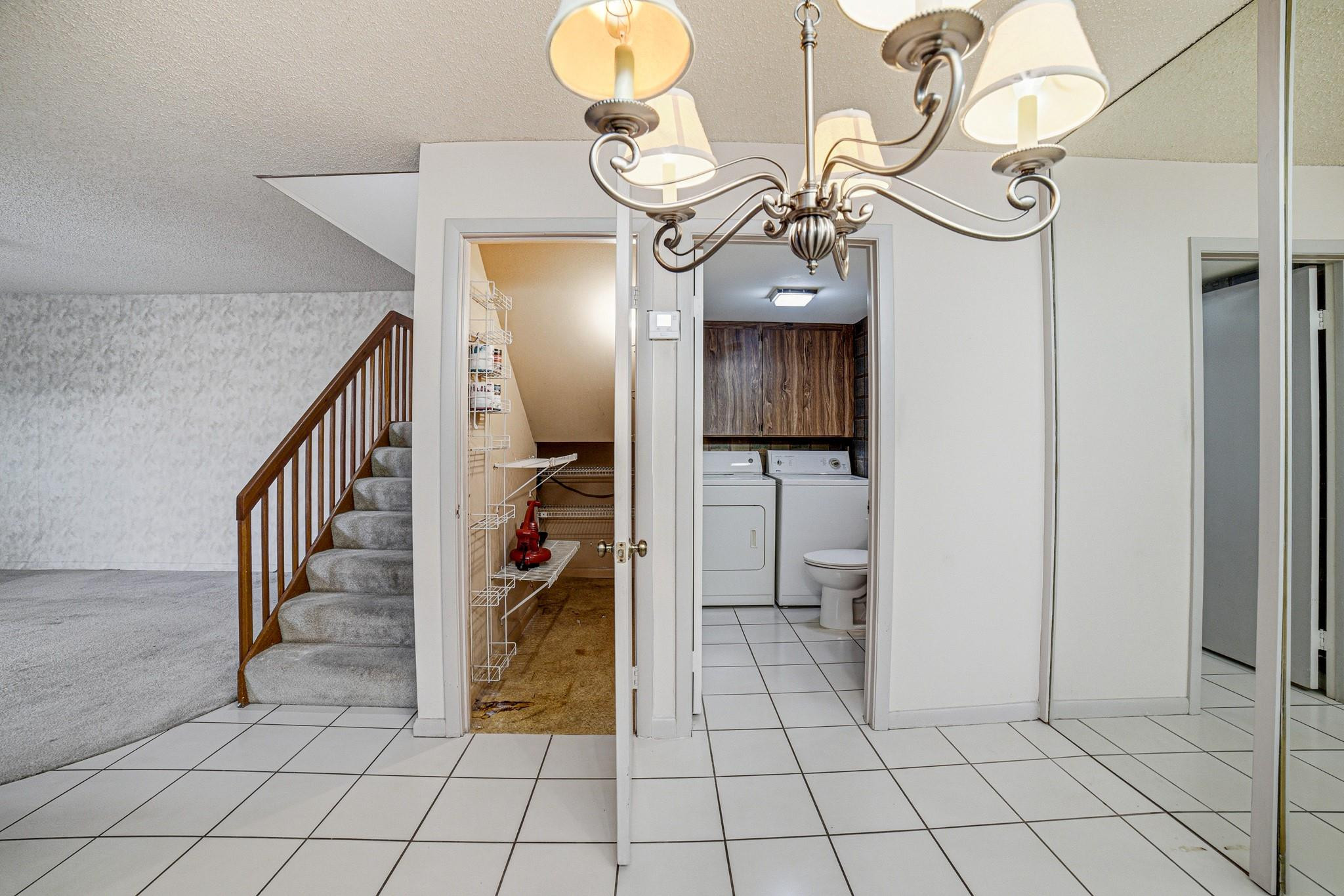 9101 Southwest 19th Place, Unit B Davie, FL 33324 - Photo 11 of 55 a view of a hallway and a chandelier