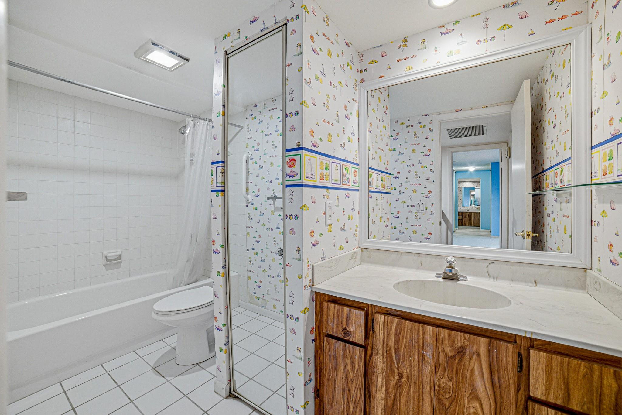 9101 Southwest 19th Place, Unit B Davie, FL 33324 - Photo 24 of 55 a bathroom with a sink a toilet and shower