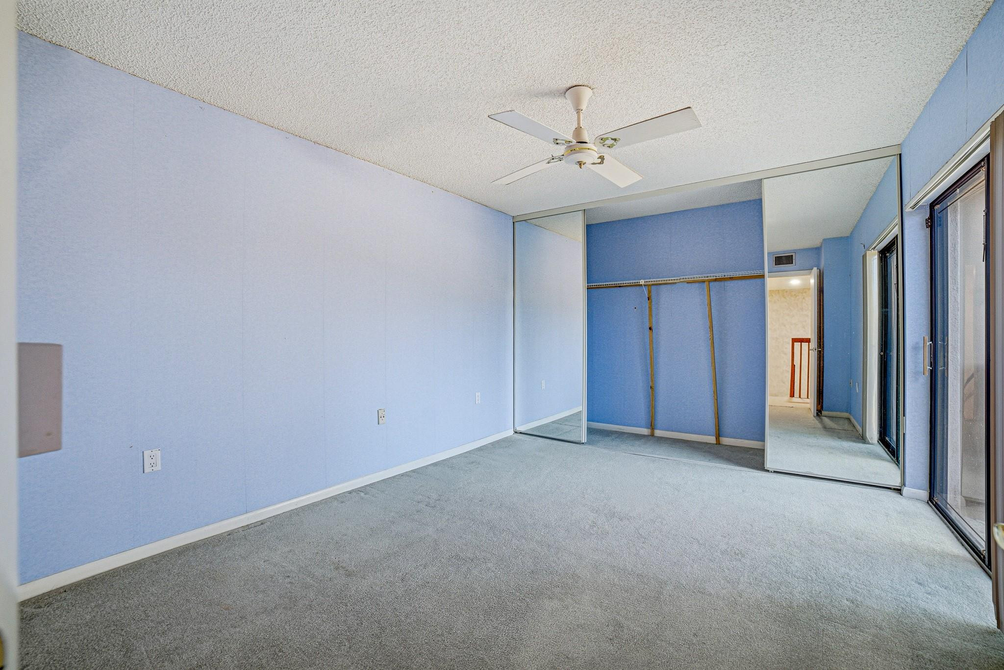 9101 Southwest 19th Place, Unit B Davie, FL 33324 - Photo 30 of 55 an empty room with closet and a ceiling fan