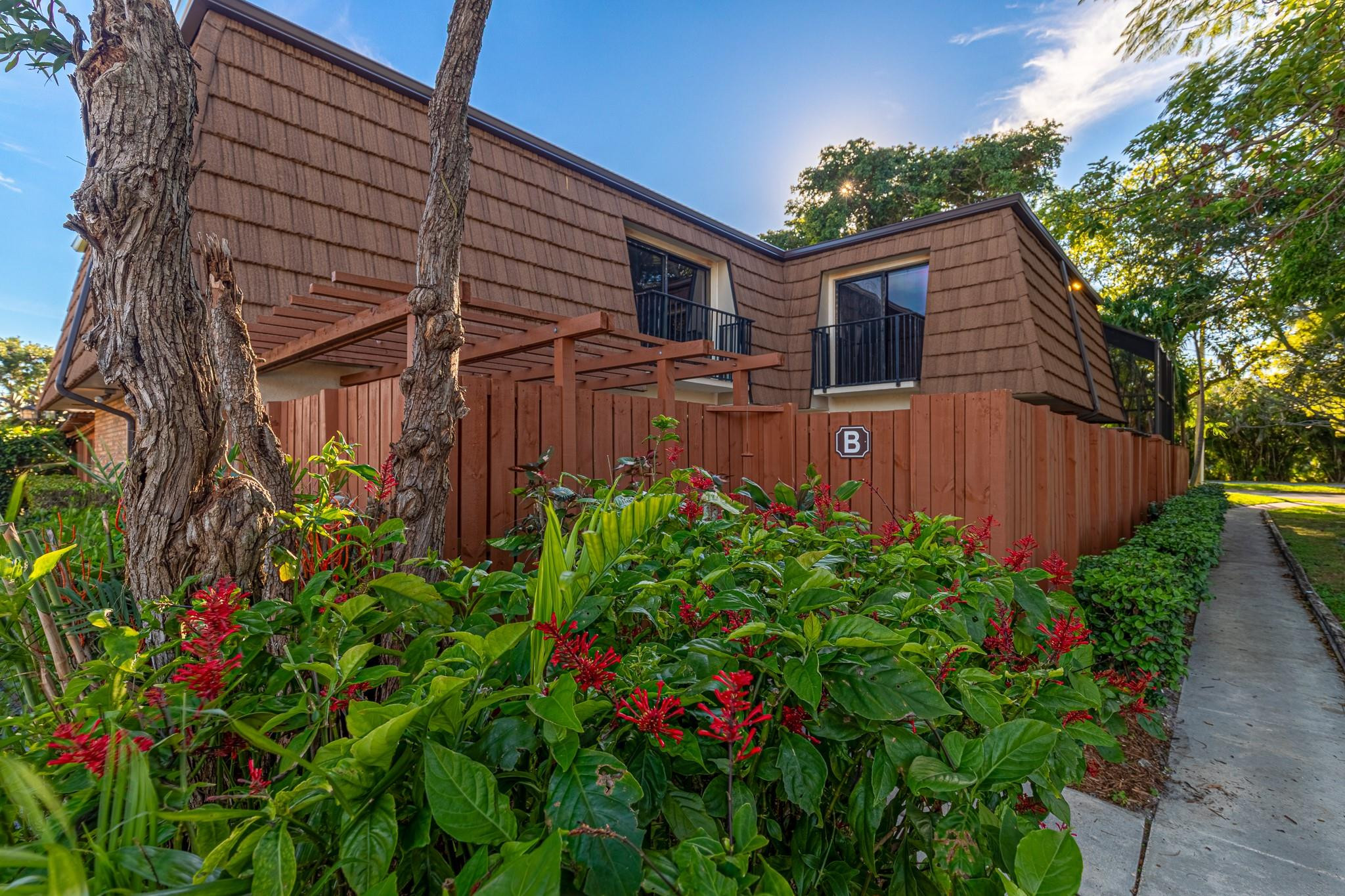 9101 Southwest 19th Place, Unit B Davie, FL 33324 - Photo 36 of 55 a backyard of a house with lots of green space