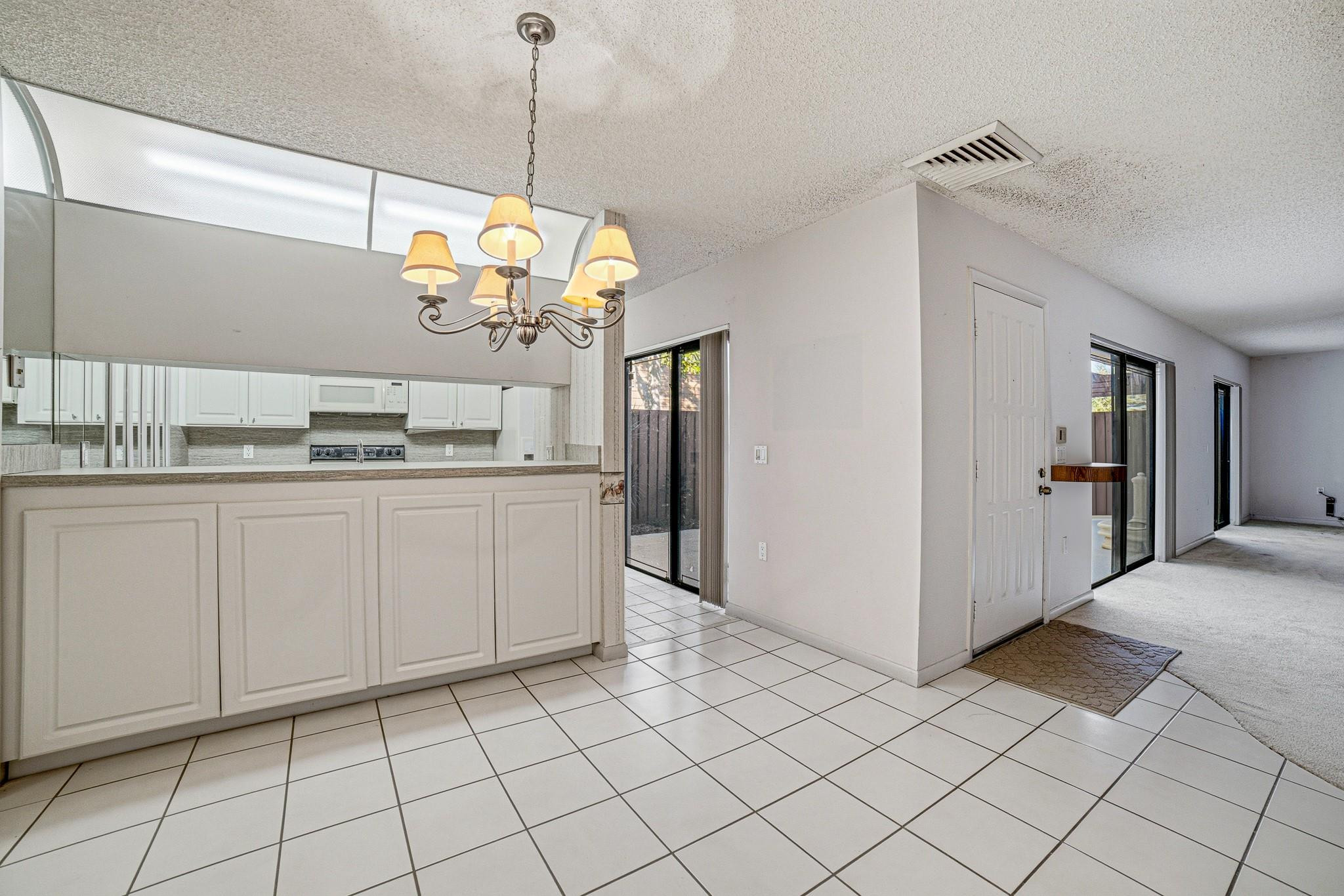 9101 Southwest 19th Place, Unit B Davie, FL 33324 - Photo 10 of 55 a kitchen with a sink cabinets and window