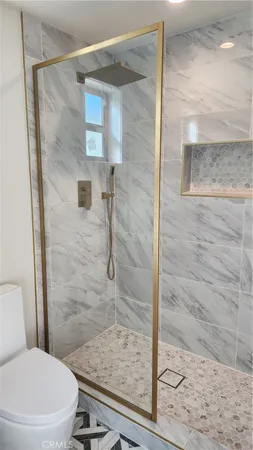 a bathroom with a shower and toilet
