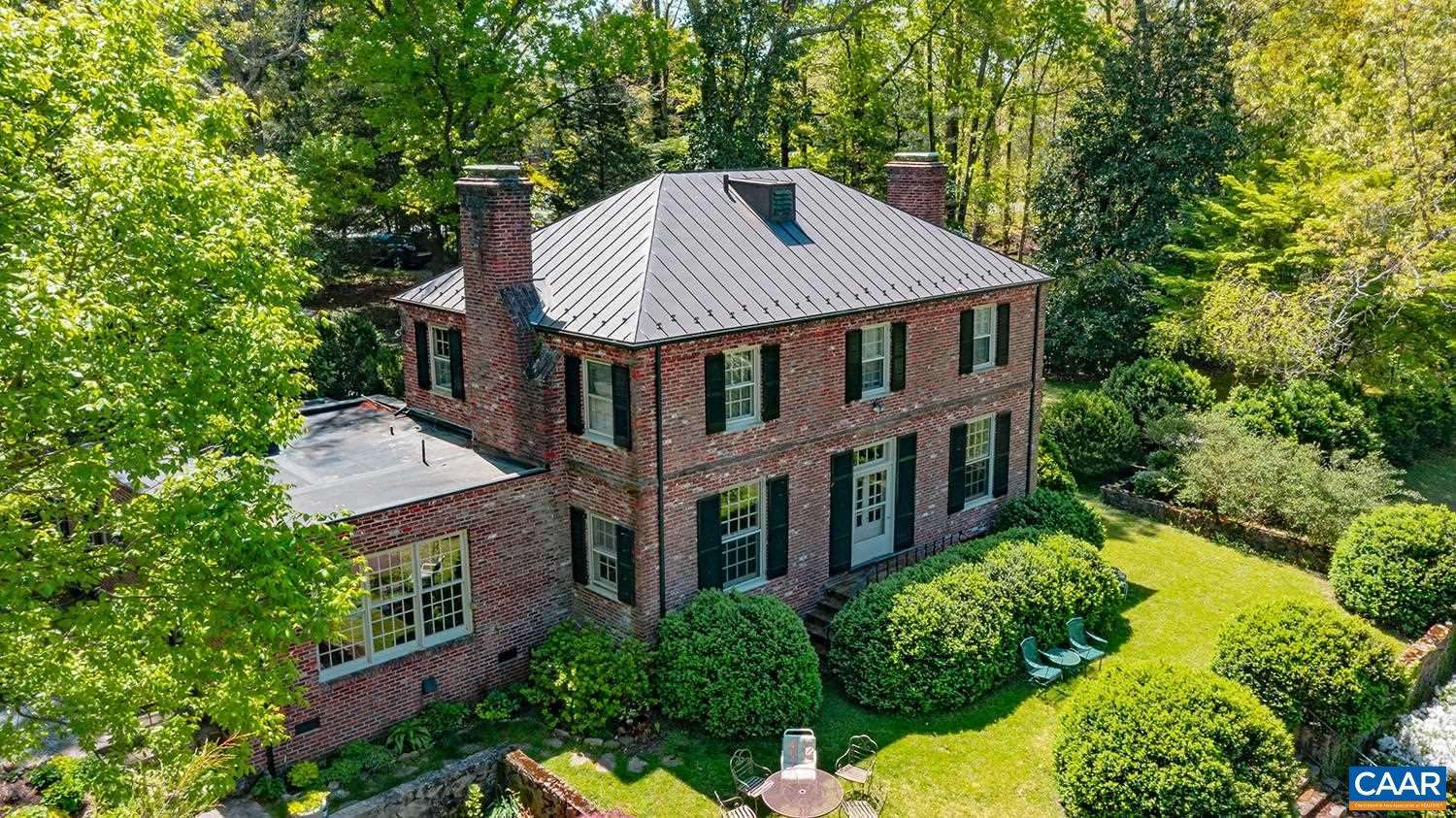 401-403 Georgetown Road Charlottesville, VA 22901 - Photo 3 of 56 a view of a house with brick walls and trees