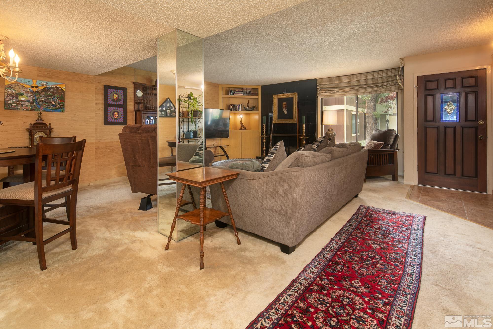 1489 Foster Drive Reno, NV 89509 - Photo 8 of 33 a living room with furniture and a rug