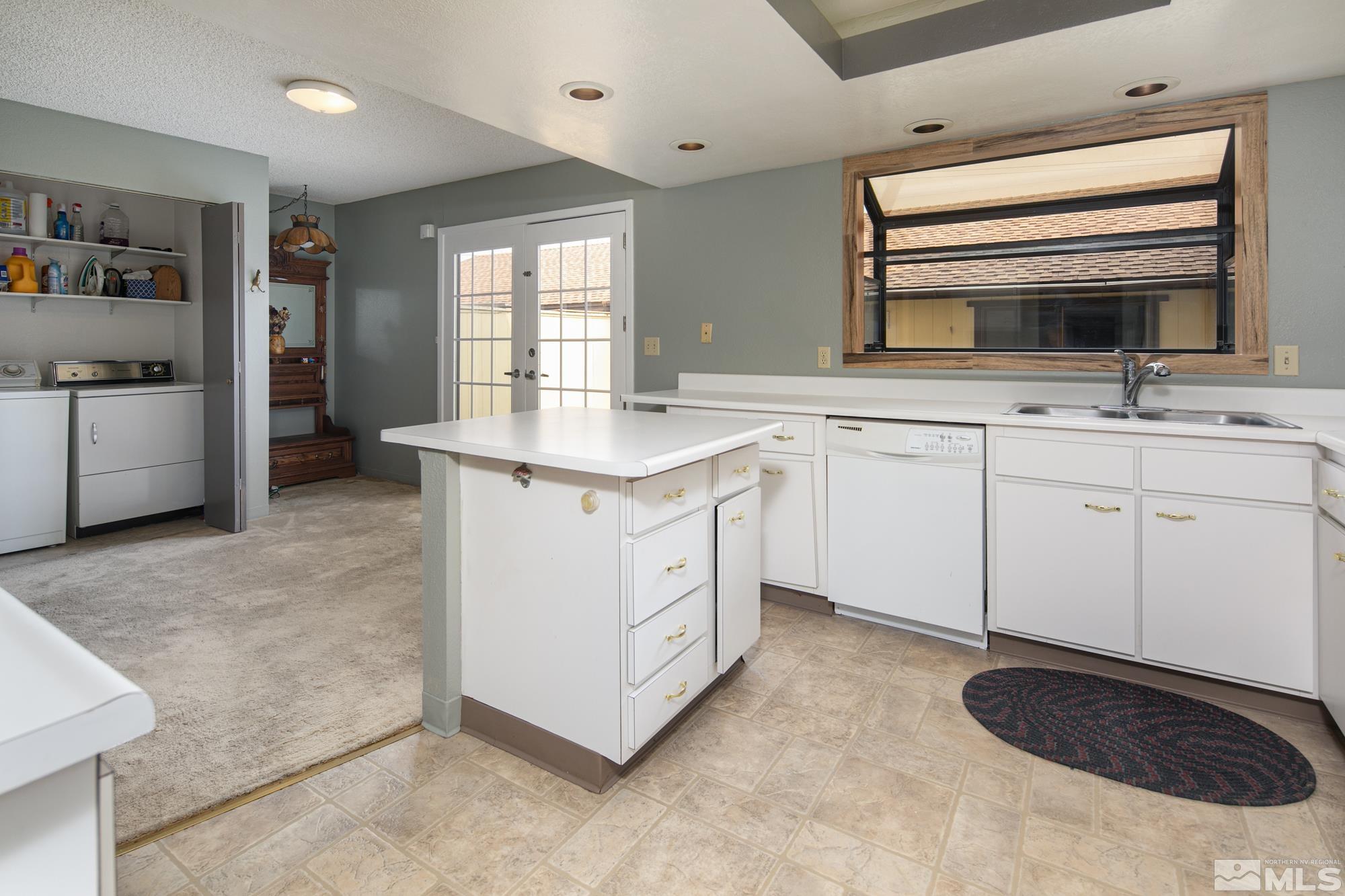 1489 Foster Drive Reno, NV 89509 - Photo 10 of 33 a kitchen with a sink stove and cabinets