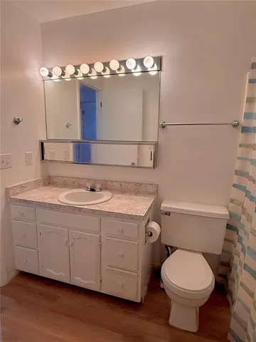 a kitchen view with a stove and a microwave oven