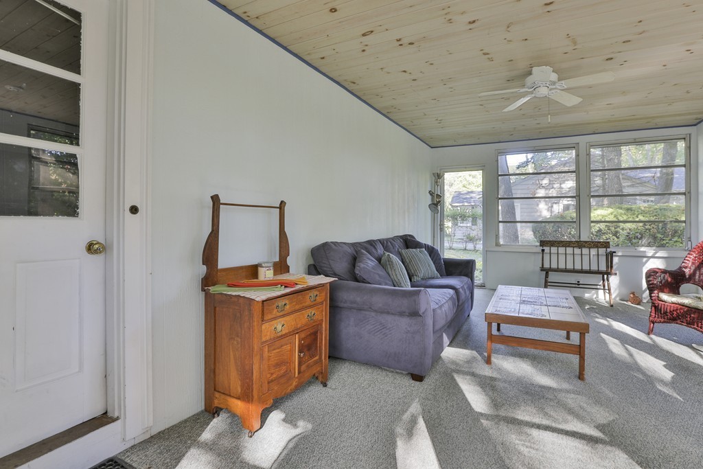 27 Gleason Road Reading, MA 01867 - Photo 20 of 28 a living room with furniture and a flat screen tv