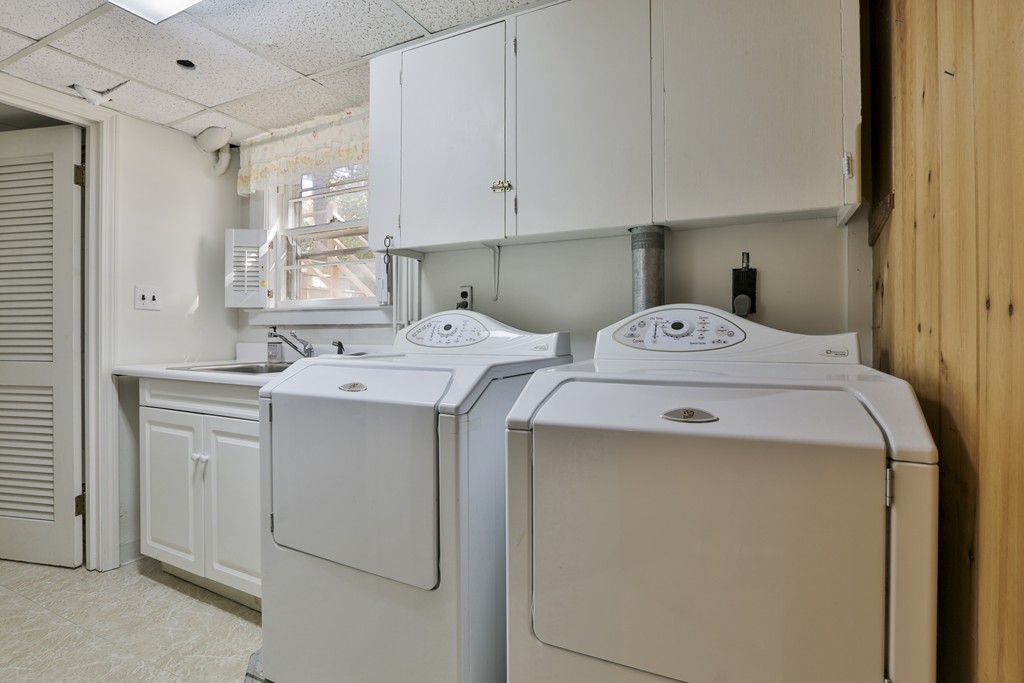 27 Gleason Road Reading, MA 01867 - Photo 23 of 28 a utility room with dryer and washer