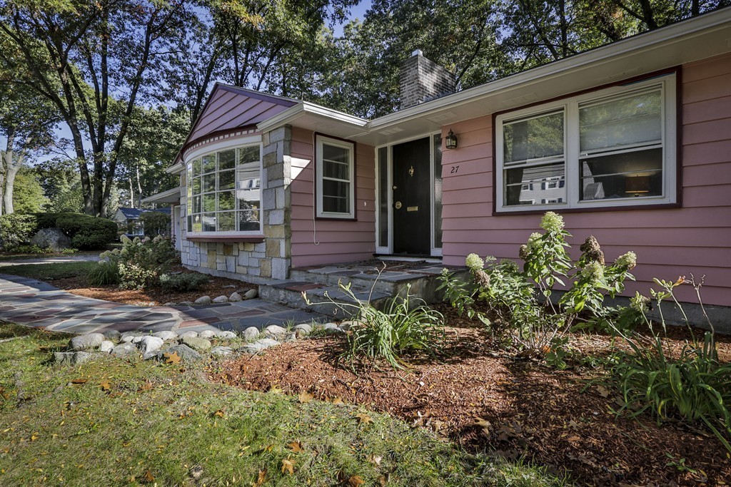 27 Gleason Road Reading, MA 01867 - Photo 26 of 28 a front view of a house with garden